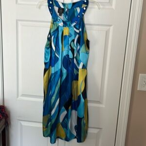 Funky shiny dress with mirrored trim around collar.